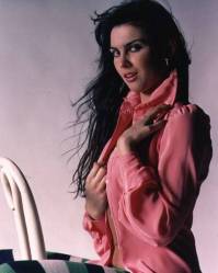 caroline_munro_in_pink_shirt_and_funky_tights